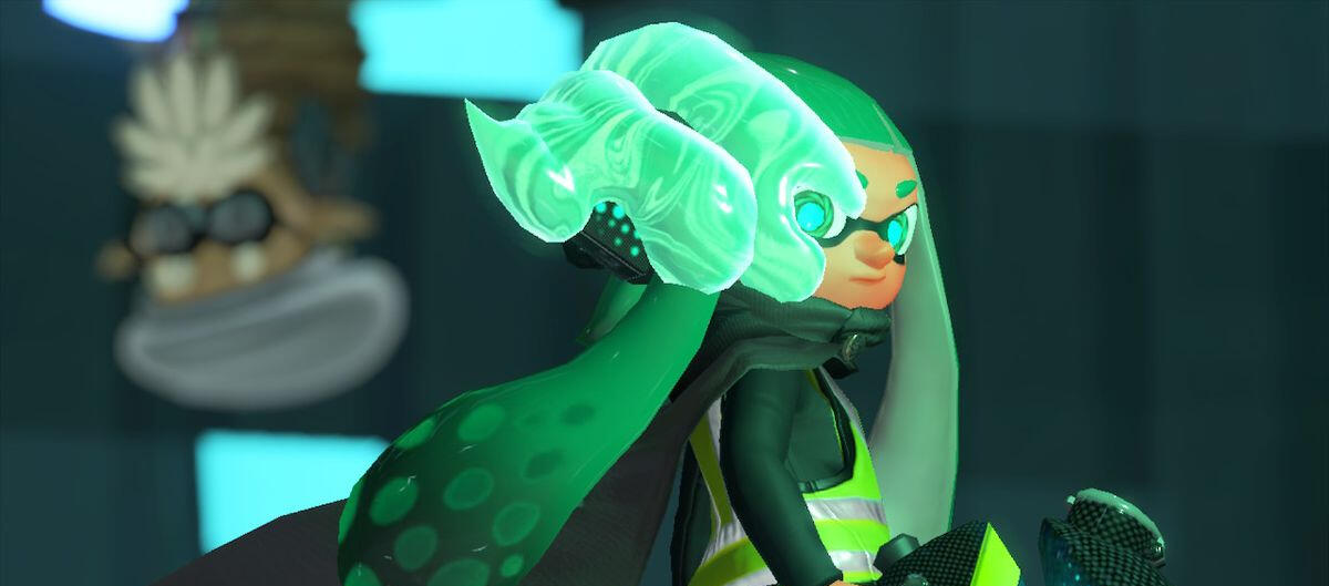 agent three from splatoon 2: octo expansion. they are partially sanitized, with teal goop around the side of their face.